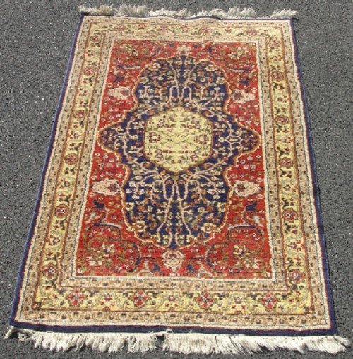 Appraisal: Small oriental scatter rug Hand woven yellow medallion Indo Persian