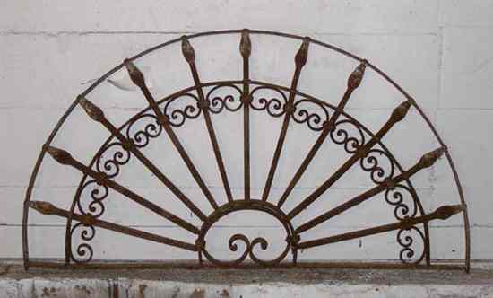 Appraisal: A Wrought Iron Arched Transom Grill circa having vertical bars