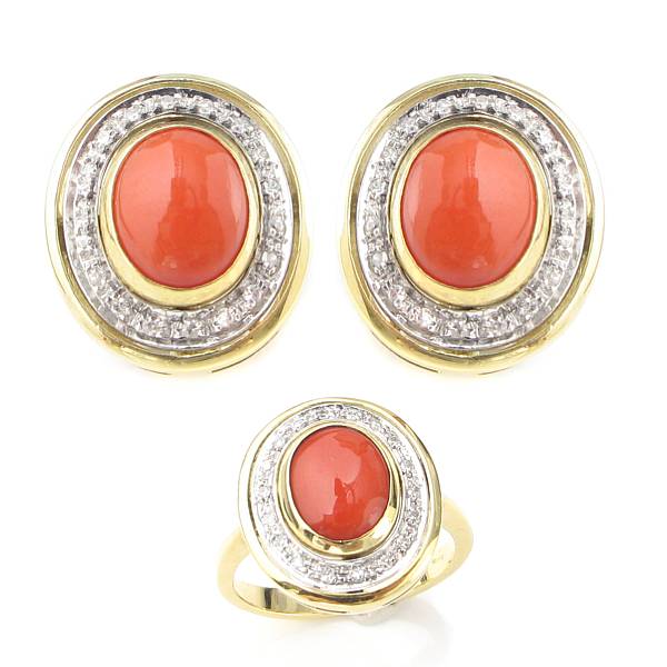 Appraisal: A coral diamond and gold ring with matching earrings oval