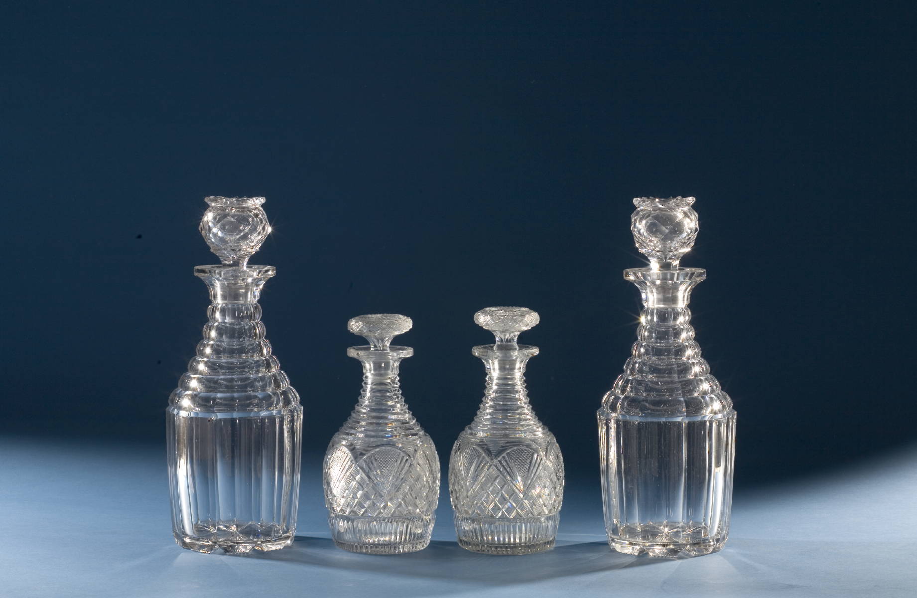 Appraisal: TWO PAIR OF ANGLO-IRISH CUT GLASS DECANTERS THE LARGER PANELLED