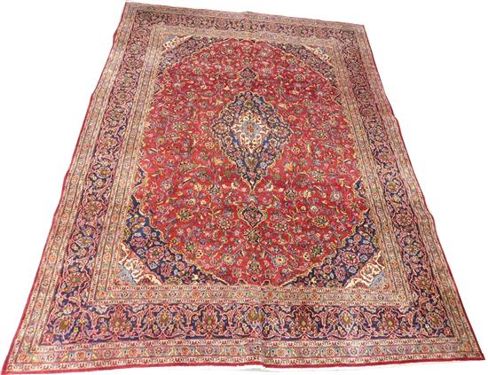 Appraisal: RUG Semi-Antique Persian Kashan carpet red field with blue borders