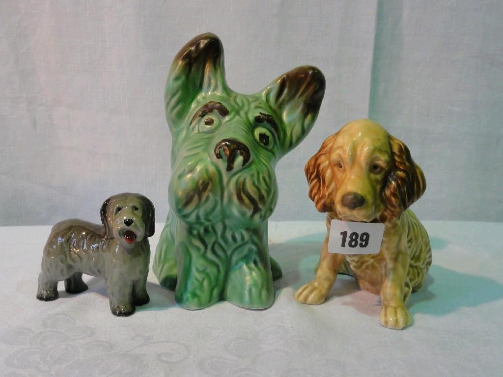 Appraisal: A Sylvac buff glazed model of a seated Spaniel with