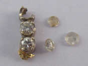 Appraisal: A mixed lot comprising five small loose polished diamonds VAT