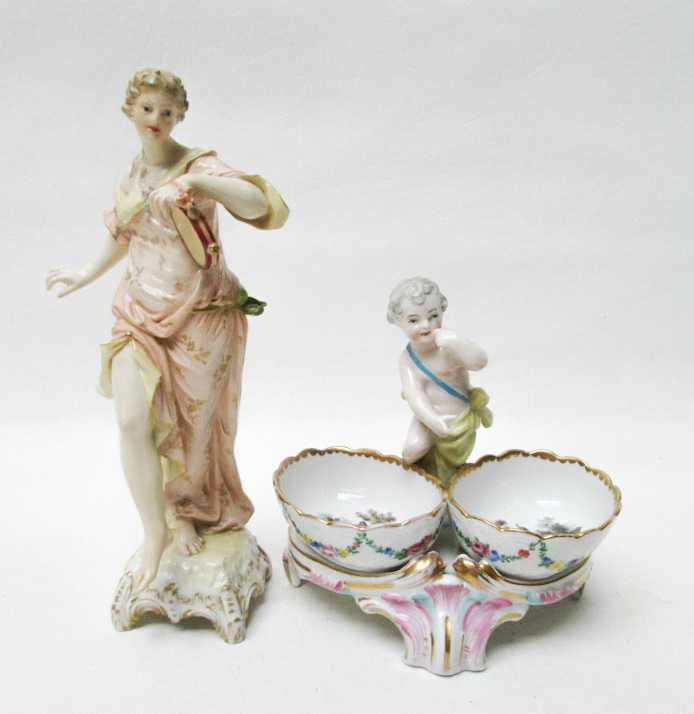 Appraisal: KPM PORCELAIN FIGURINE AND FIGURAL MASTER SALT The figurine of