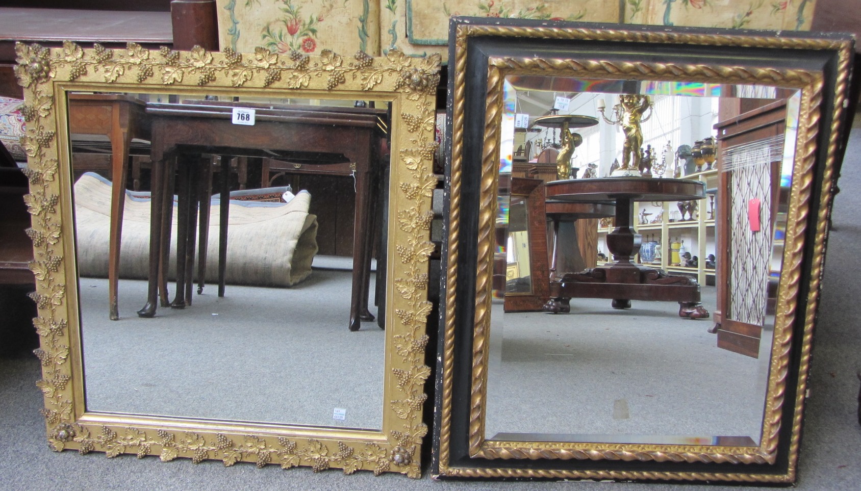 Appraisal: A th century gilt framed square wall mirror with vine