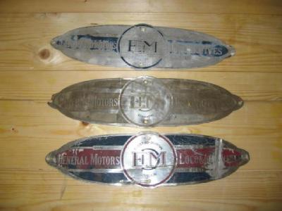 Appraisal: Three General Motors locomotive plates from the Electro-Motive Division modified