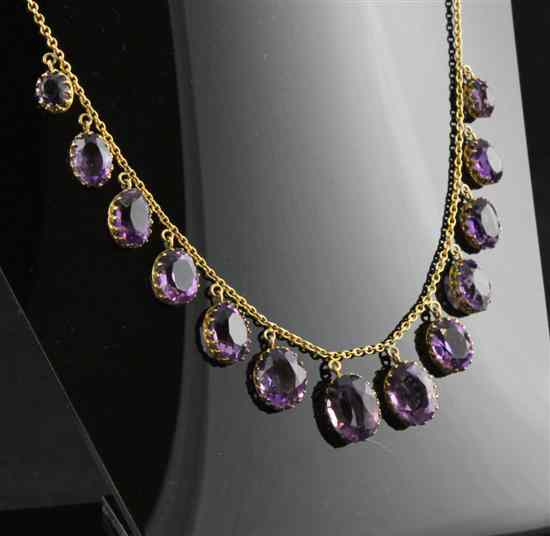 Appraisal: A ct gold and amethyst fringe necklace set with thirteen