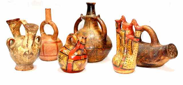 Appraisal: A GROUP OF FOUR NORTH AFRICAN CERAMIC WATER CARRIERS with