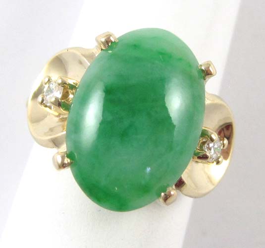 Appraisal: JADE DIAMOND AND FOURTEEN KARAT GOLD RING separating a pair