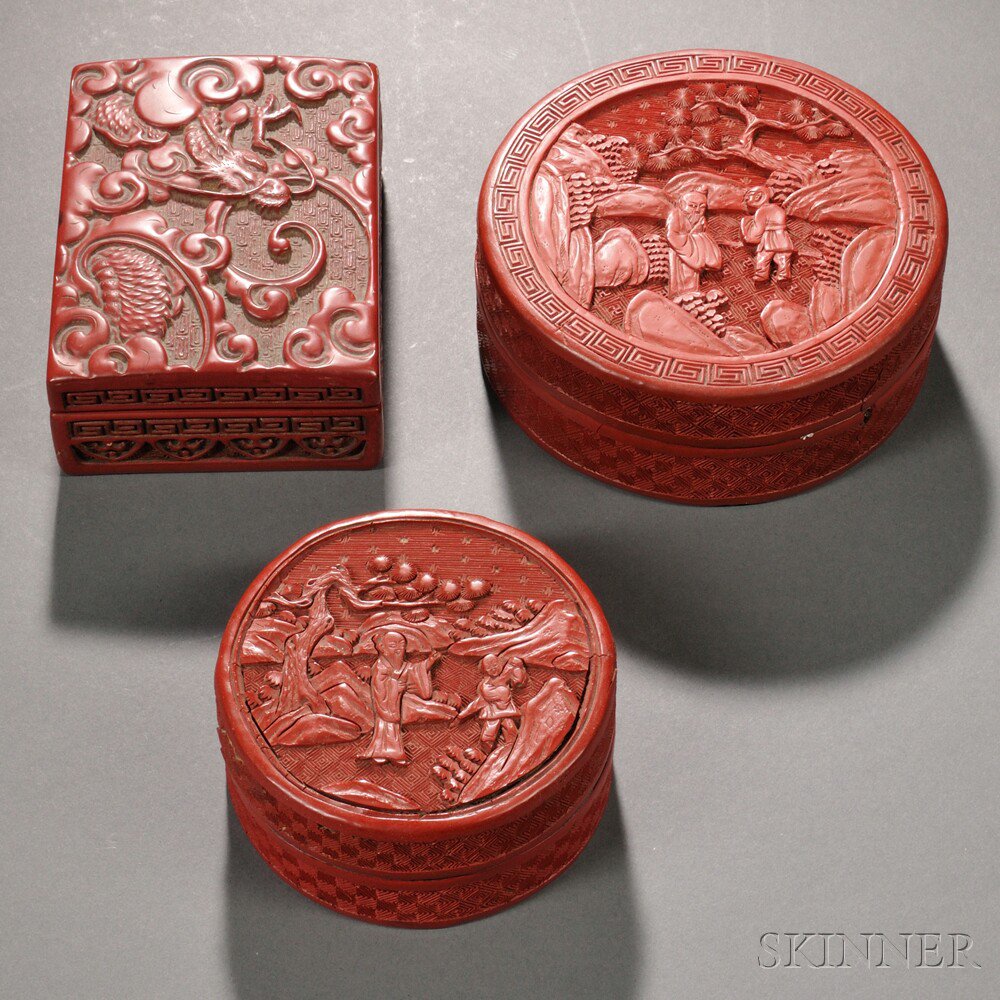 Appraisal: Three Cinnabar Covered Cases China two round export cases carved