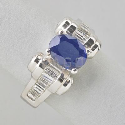 Appraisal: SAPPHIRE AND DIAMOND PLATINUM RING Odeonesque design centrally set oval