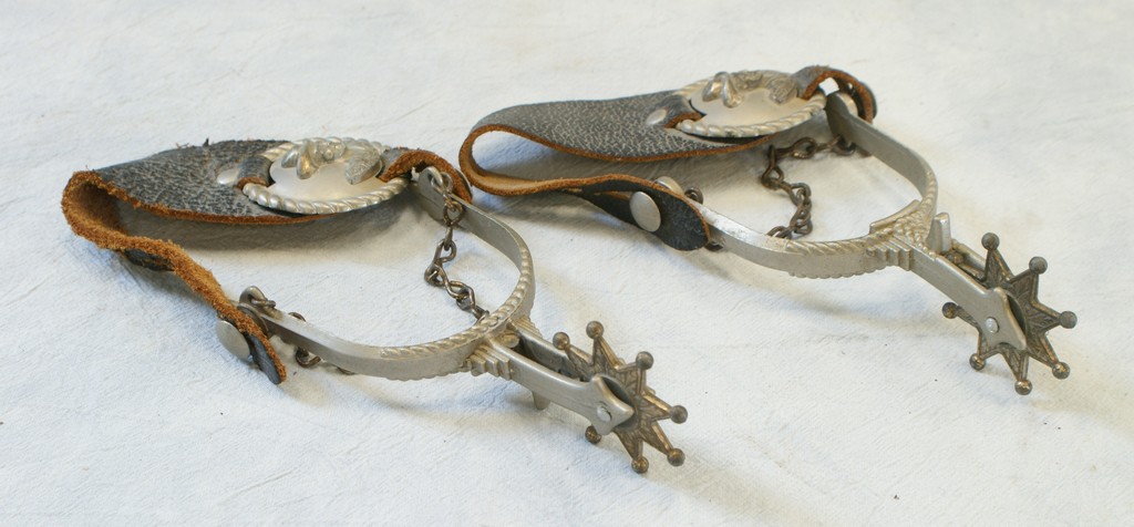 Appraisal: Pair of Hopalong Cassidy spurs with leather straps and metal