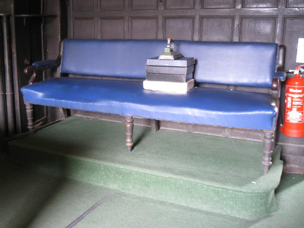 Appraisal: A th Century mahogany Bench with shaped arms blue upholstered