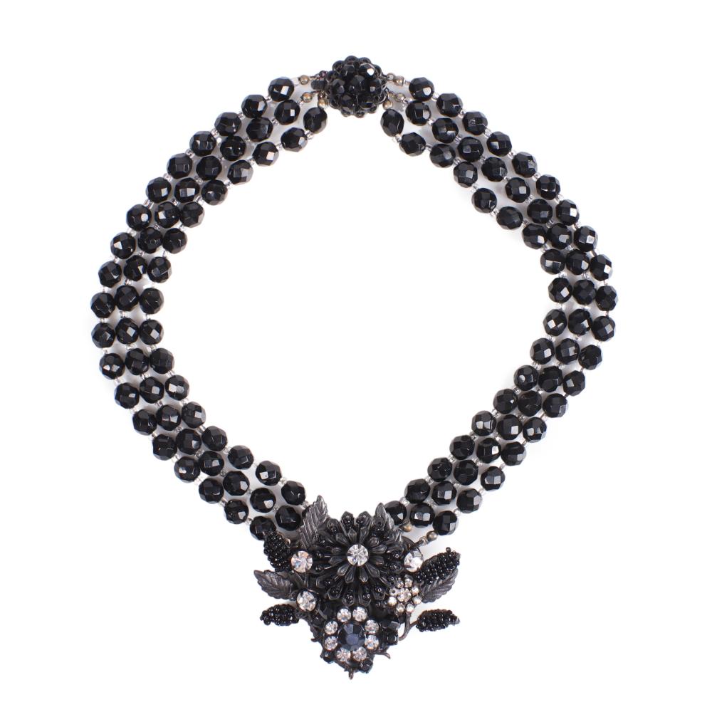 Appraisal: MIRIAM HASKELL JAPANNED BLACK METAL AND FACETED BLACK CRYSTAL MULTI-STRAND