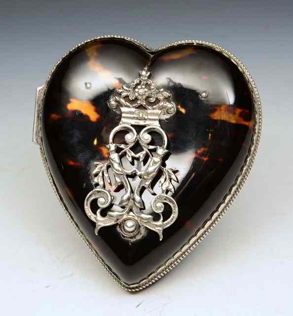 Appraisal: A LATE VICTORIAN SILVER AND TORTOISESHELL HEART SHAPED FOLDING PHOTO