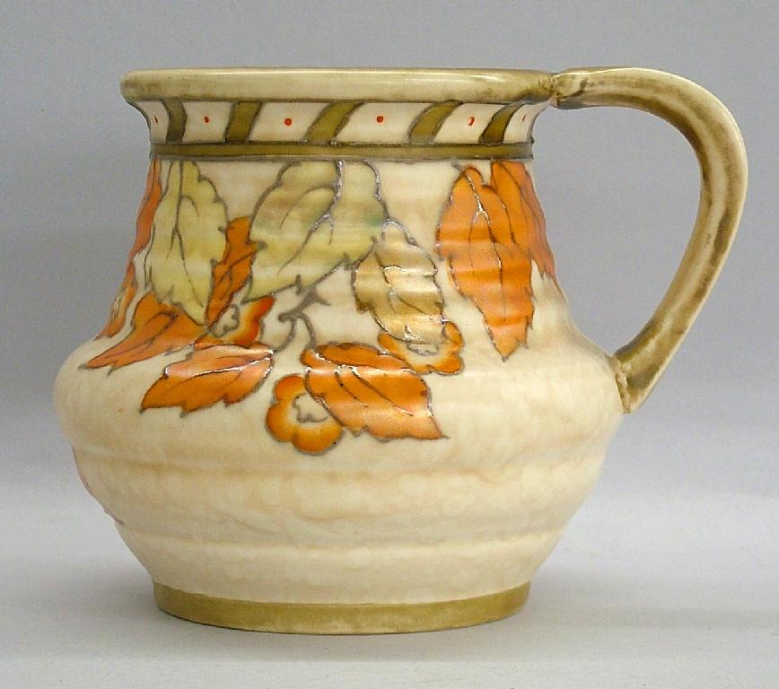 Appraisal: Charlotte Rhead Crown Ducal 'Golden Leaves' ovoid ribbed jug pattern