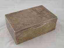 Appraisal: A silver cigarette box with engine turned finish mark of