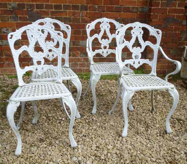 Appraisal: A SET OF FOUR ALUMINIUM AND WHITE PAINTED GARDEN CHAIRS