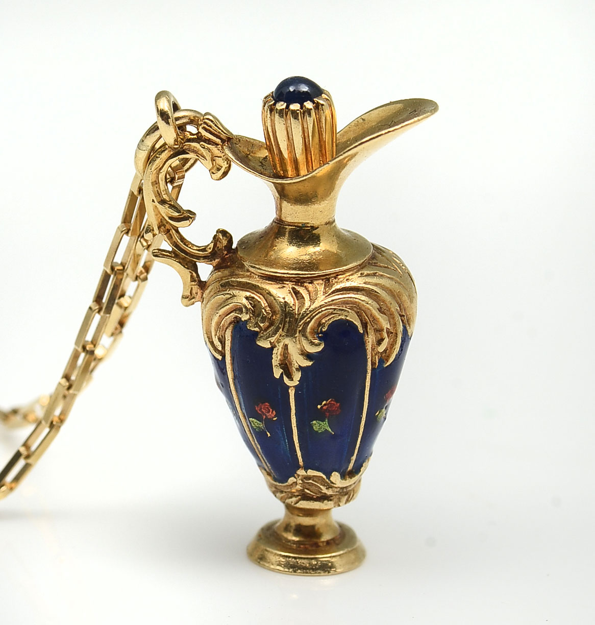 Appraisal: K ''BREV'' ENAMELED SCENT BOTTLE AND CHAIN Beautifully detailed enameled