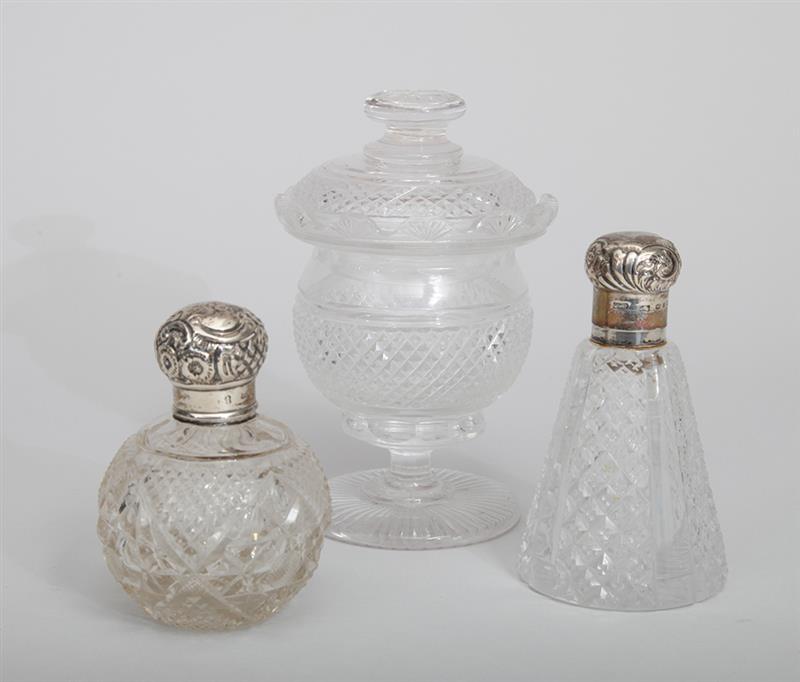 Appraisal: TWO ENGLISH CUT-GLASS SCENT BOTTLES With silver pop-off mushroom lids