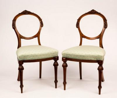 Appraisal: A pair of Victorian balloon back chairs