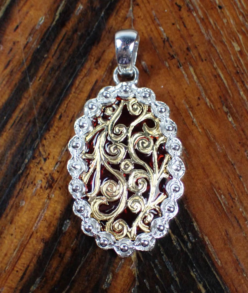 Appraisal: ITALIAN MADE FOURTEEN KARAT GOLD PENDANT with a k white