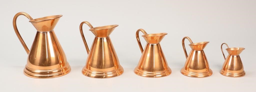 Appraisal: Set of graduated copper pitchers Largest H smallest H Minor