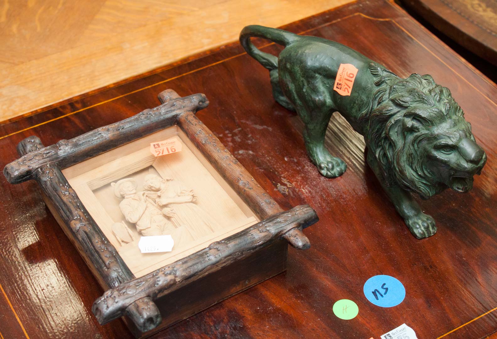 Appraisal: Framed carved wood diorama and bronze lion lion is hollow