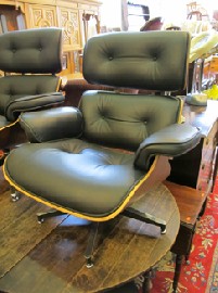 Appraisal: BLACK EAMES STYLE LOUNGE CHAIR WITH MATCHING OTTOMAN