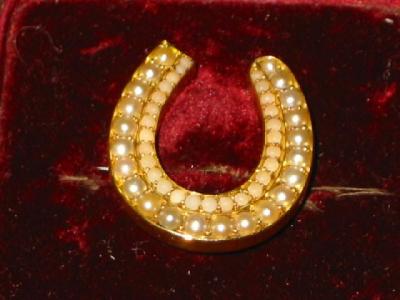 Appraisal: A VICTORIAN PEARL BROOCH modelled as a horse shoe in