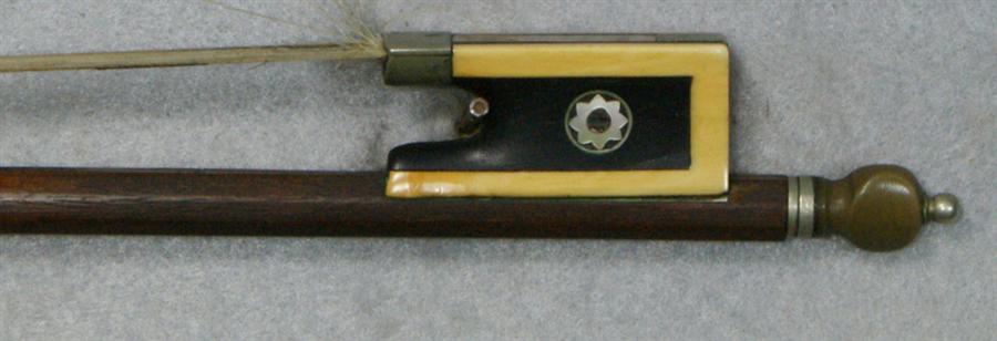 Appraisal: Unsigned violin bow octagonal shaft ebony frog mounted with ivory