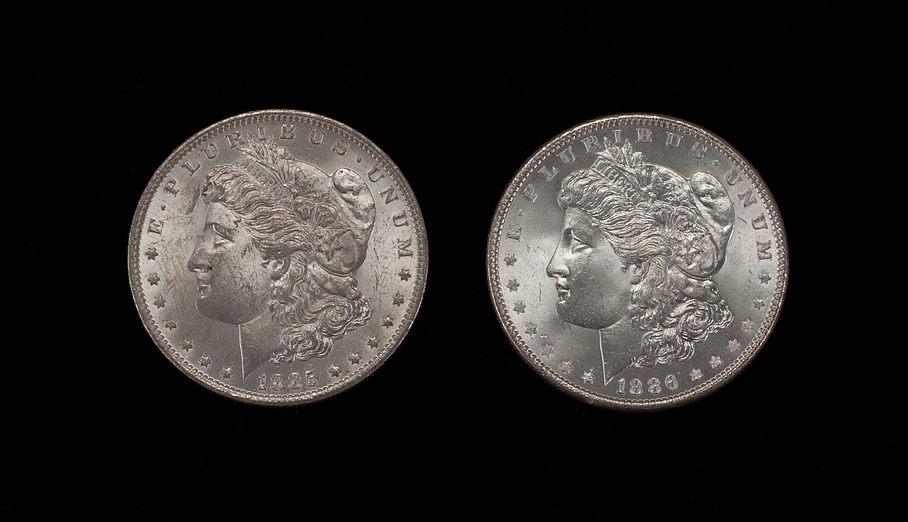 Appraisal: TWO U S MORGAN SILVER DOLLARS -O and Pin Wheeling