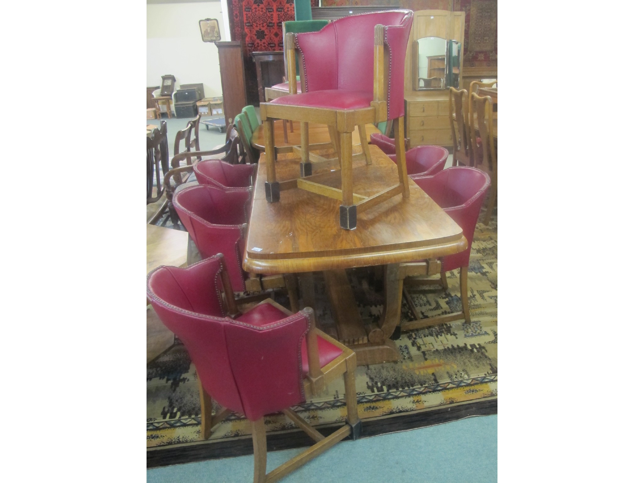 Appraisal: An Art Deco style dining table and eight chairs