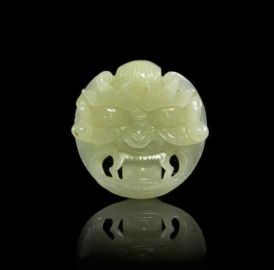 Appraisal: A Carved Jade Mask Form Belt Buckle of near white