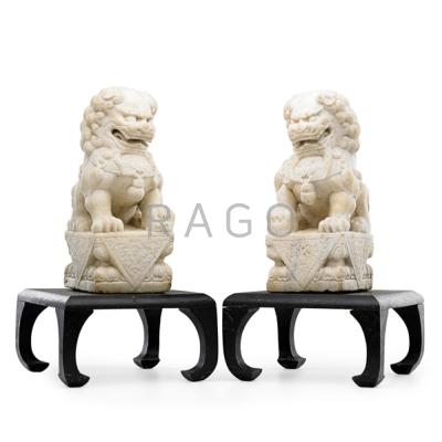 Appraisal: PAIR OF ASIAN MARBLE FOO DOGS Mounted on hardwood plinths