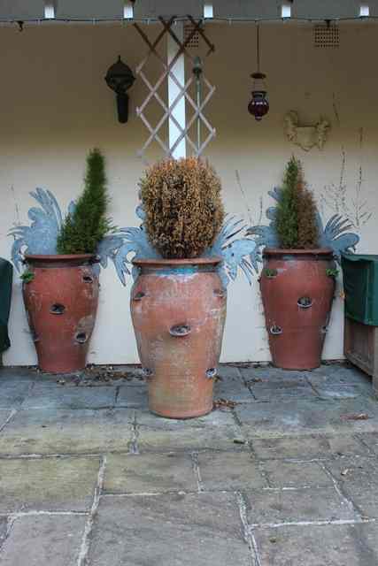 Appraisal: FOUR TALL WHICHFORD POTTERY TERRACOTTA 'D' SHAPED STRAWBERRY PLANTERS for