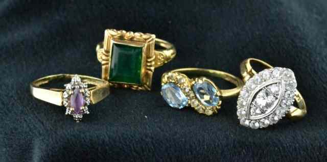 Appraisal: PCS LADY'S RINGSConsisting of four karat gold rings with green