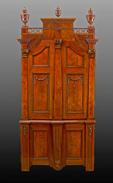 Appraisal: A Continental Neoclassical style walnut cabinet th century The stepped