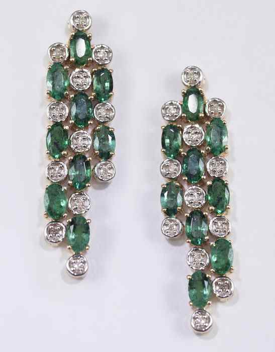 Appraisal: K GOLD DIAMOND EMERALD EARRINGS K yellow gold earrings contain