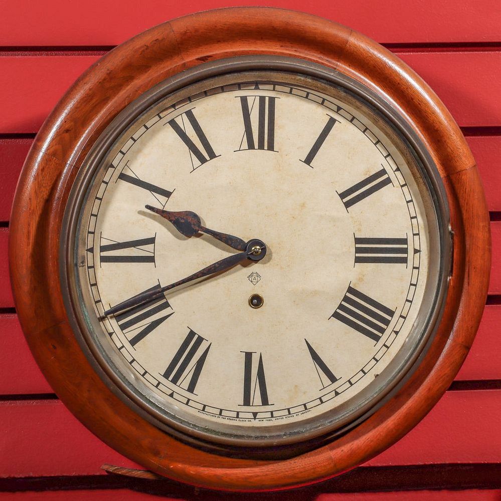 Appraisal: AN ANSONIA WALNUT GALLERY CLOCK The walnut case and circular