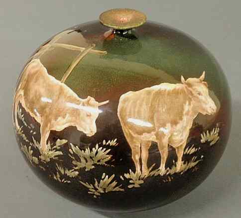 Appraisal: Art pottery vase decorated with cows on a green black