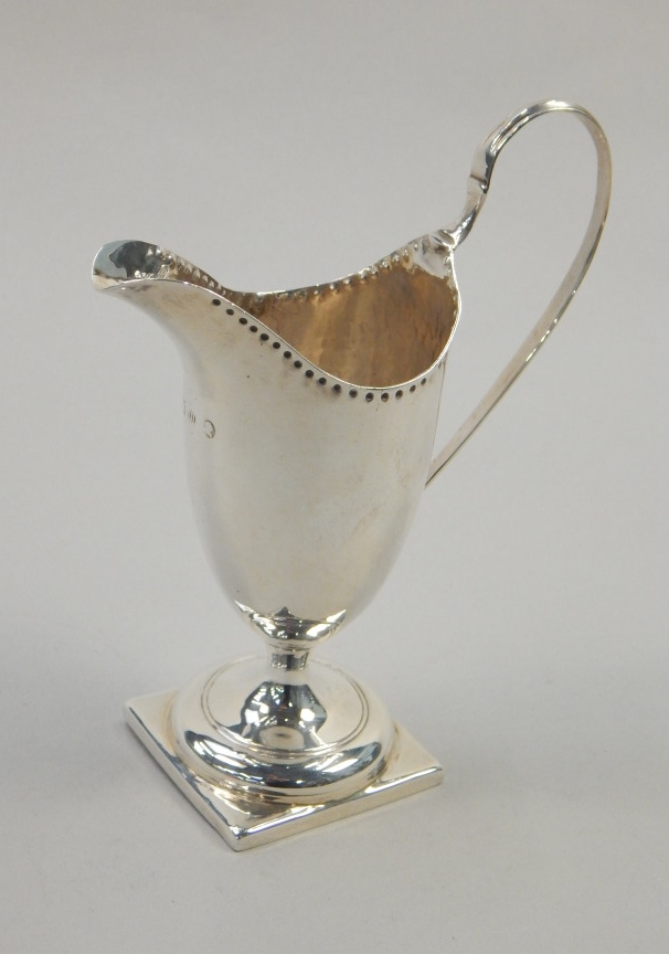 Appraisal: A George IV helmet shaped silver cream jug on a