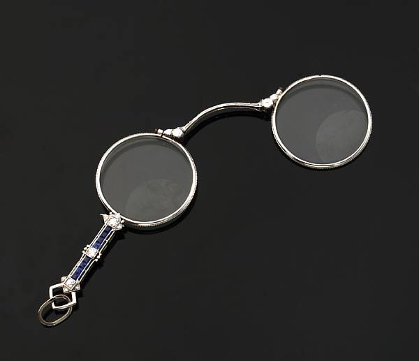 Appraisal: An art deco diamond and sapphire lorgnette mounted in platinum