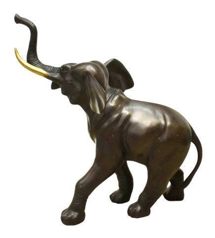 Appraisal: Large patinated bronze wildlife sculpture Walking Elephant having raised trunk