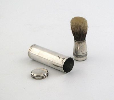 Appraisal: A George IV travelling shaving brush tubular with a pull