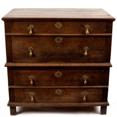 Appraisal: A Jacobean oak chest of four long drawers with drop