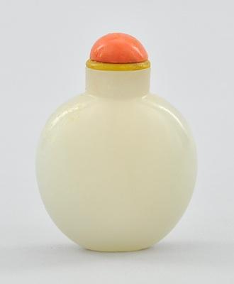 Appraisal: A Carved White Jade Snuff Bottle with Coral Stopper Of