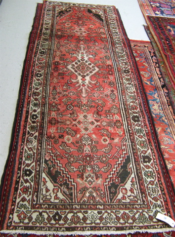 Appraisal: PERSIAN HAMADAN RUNNER central medallion and Heratif floral decoration on