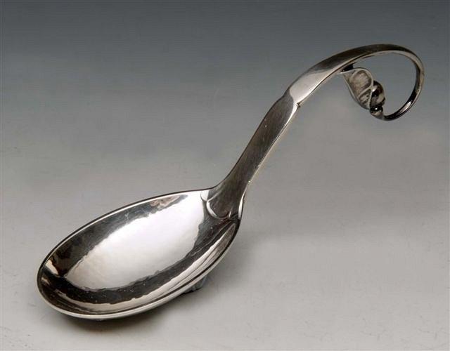 Appraisal: A GEORG JENSEN HAMMERED SILVER JAM SPOON with looped stylised