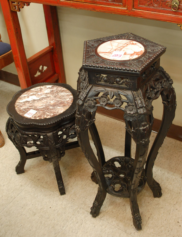 Appraisal: TWO CARVED BLACKWOOD PEDESTAL TABLES Chinese export early th century